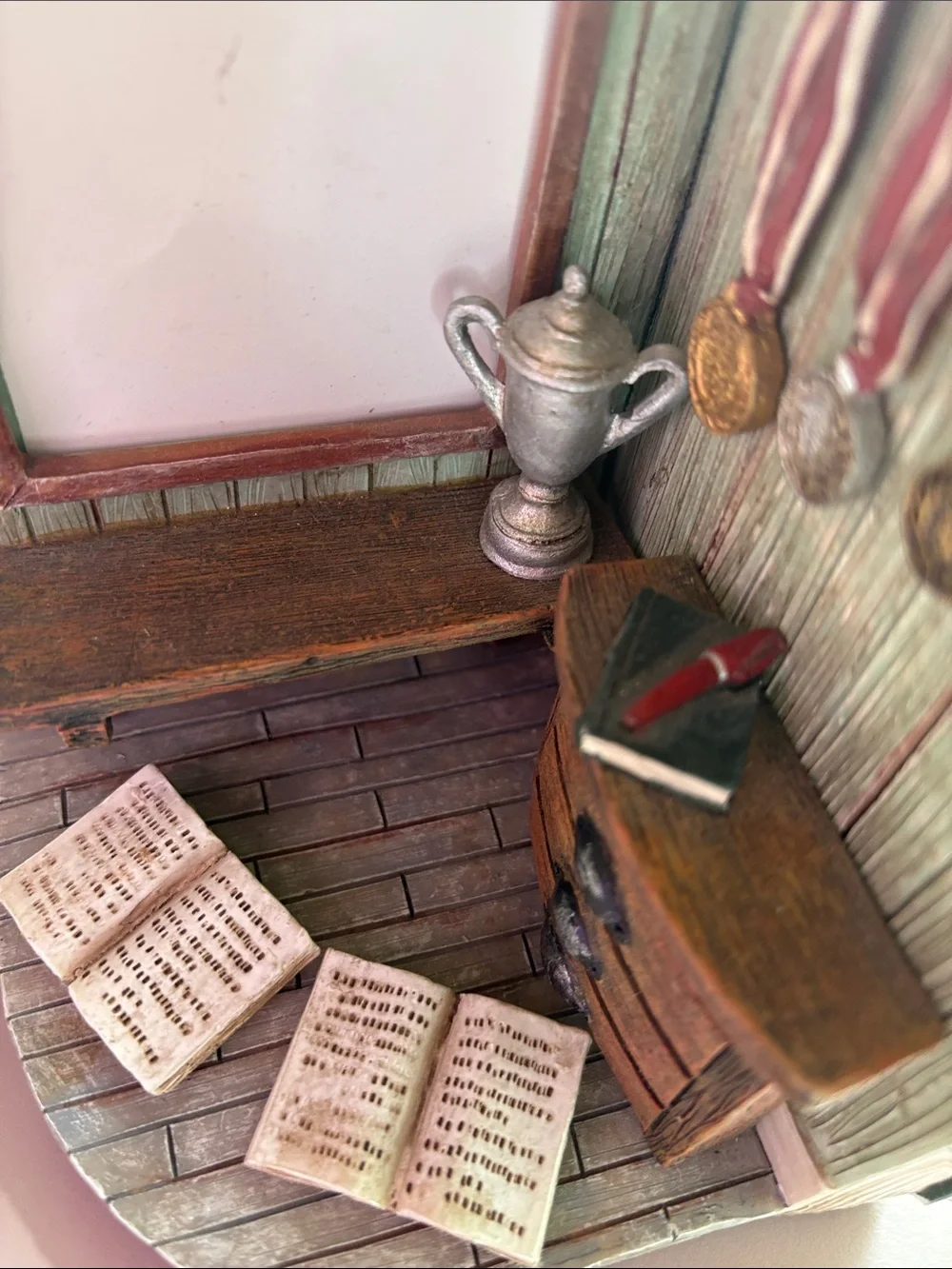 Picture frame decoration with open book and awards